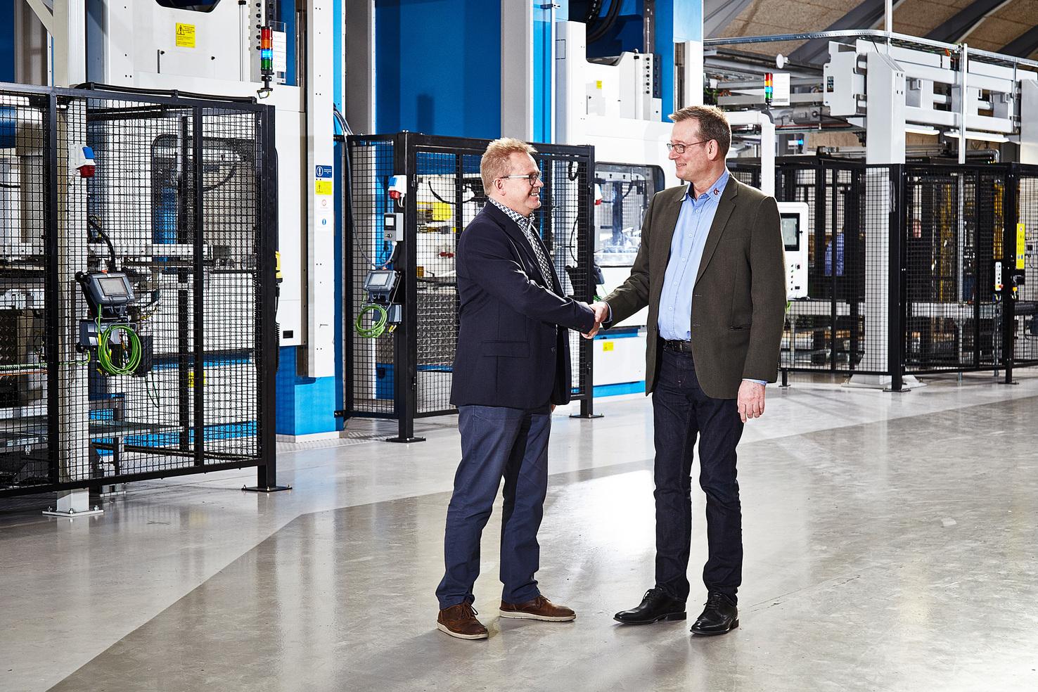 With the new line in operation, 90% of CK Deep Drawing’s production is automated. Pictured here are Peter Karlsson from AP&T (left) and CK Deep Drawing’s CEO Peter Møller (right).